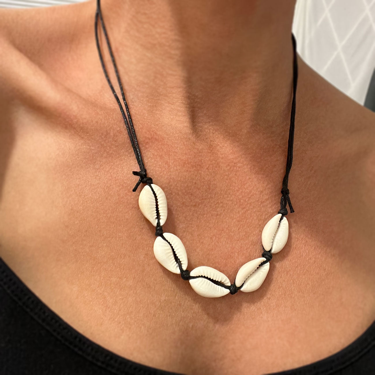 Dive into the Dark Allure of a Cowrie Shell Necklace in Black!
