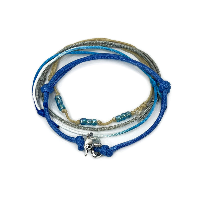 Blue dolphin charm bracelet with beaded accents on adjustable cord from O Yeah Gifts.