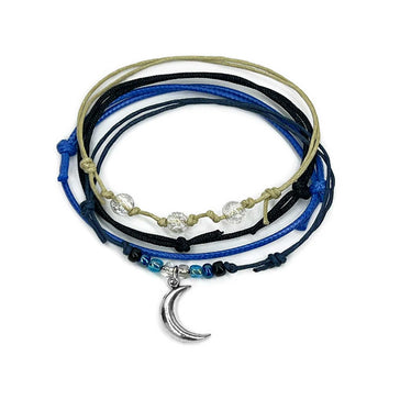 Moon Bracelet Style Pack with 4 waterproof stackable beaded bracelets in blue and black tones plus a silver moon charm. Perfect for night owls, dreamers and astrology lovers.