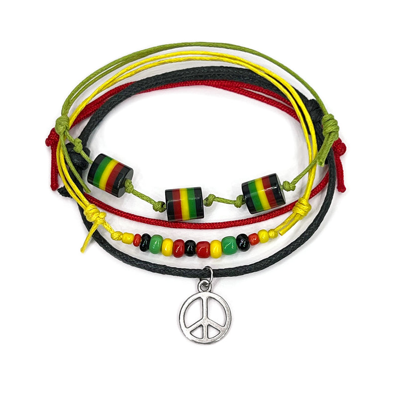 O Yeah Gifts Silver Peace Sign Bracelet with Rasta-Colored Beads – A hippie-inspired bracelet featuring a silver peace charm, vibrant Rasta beads and earthy cords. Perfect for embracing Jamaican style, peace and festival vibes.