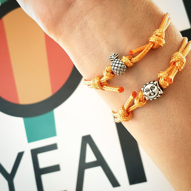 O Yeah Gifts Pineapple Bracelet – Wrist shot showing the yellow cord and pineapple charm, ideal for a playful tropical look and summertime style.