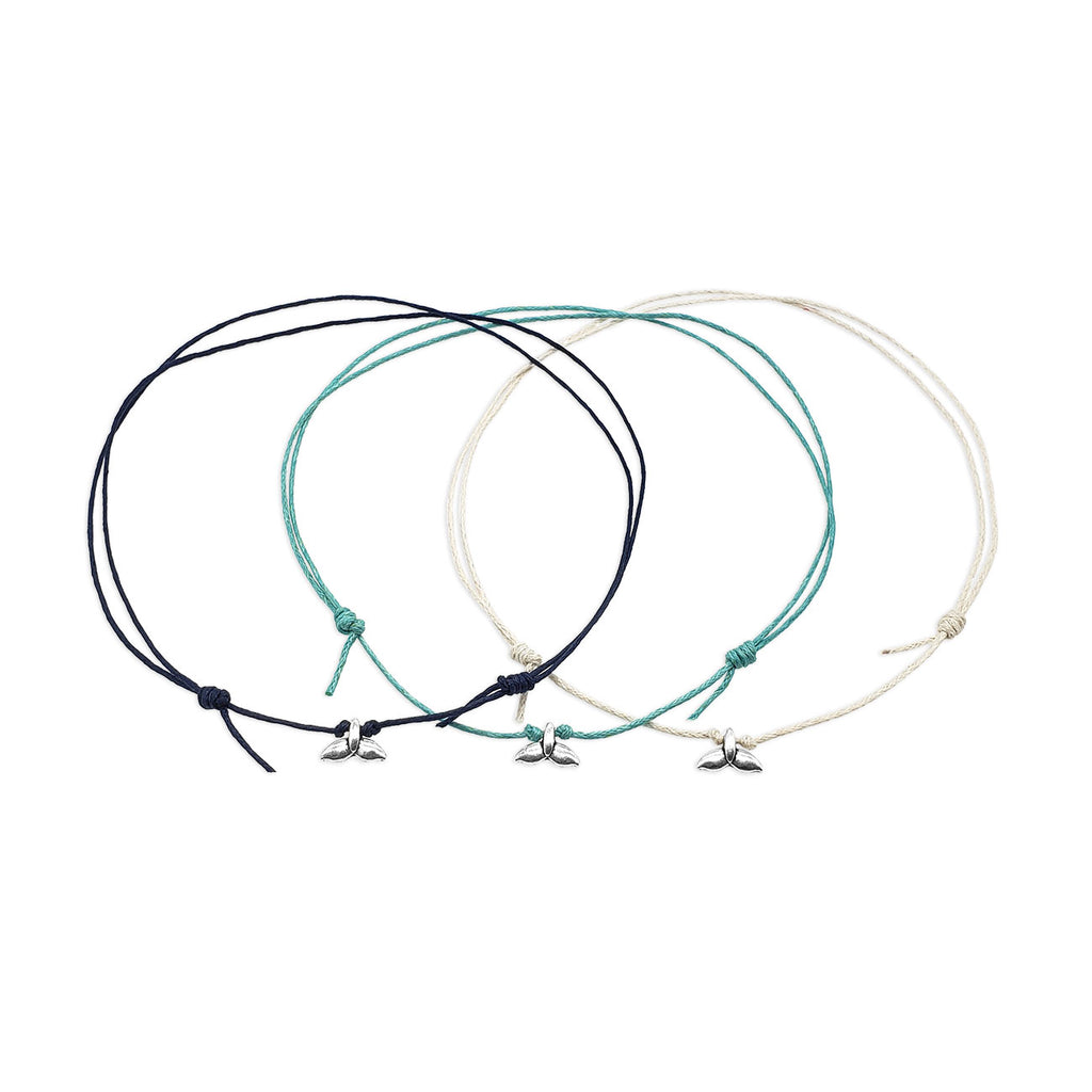 Whale Tail Choker Necklace layered with other beach accessories for a trendy ocean-inspired style.