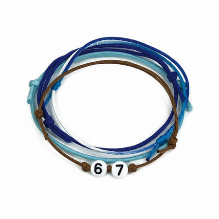 Blue 67 string bracelet set featuring a mix of aqua, navy, white and brown cords tied with adjustable slip-knots and accented by white number beads reading ‘67.’ A waterproof, school-friendly friendship bracelets inspired by the 6-7 hand gesture meme, perfect for teens, TikTok fans, best friends and anyone who loves stackable coastal vibe jewelry.