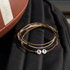 Brown 67 bracelet from O Yeah Gifts resting on a black backpack next to a textured football, game day flat lay featuring 6-7 meme bracelet and six seven meme accessory, perfect 67 trend bracelet for football fans and overtime elite 6-7 style vibes, six seven funny gift and 6-7 meme merchandise you can buy 6-7 bracelet online, school friendly accessory and viral gen alpha accessory for the friendship bracelet trend and viral bracelets for school.