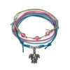 Pink sea turtle bracelet stack on white: a beaded bracelet, a beaded bracelet with a silver-tone sea turtle charm and two string bracelets in pink, blue and beige.