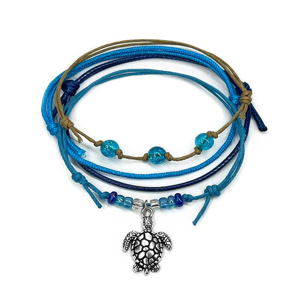 Sea Turtle Bracelet Style Pack in Blue: 4 bright blue, navy, turquoise and tan bracelets with a silver-tone sea turtle charm, on white