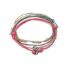 Pink dolphin charm bracelet with adjustable cord and beads from O Yeah Gifts.