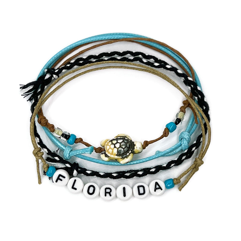 Black Florida Letter Bead Bracelet with bold black beads and a sea turtle charm, part of the O Yeah Gifts style pack. Sleek and stylish, perfect for showcasing Florida pride with tropical, modern vibes.