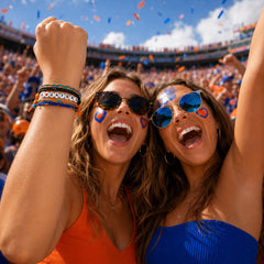 Fans cheering in the stands wearing I Heart Gators bracelets