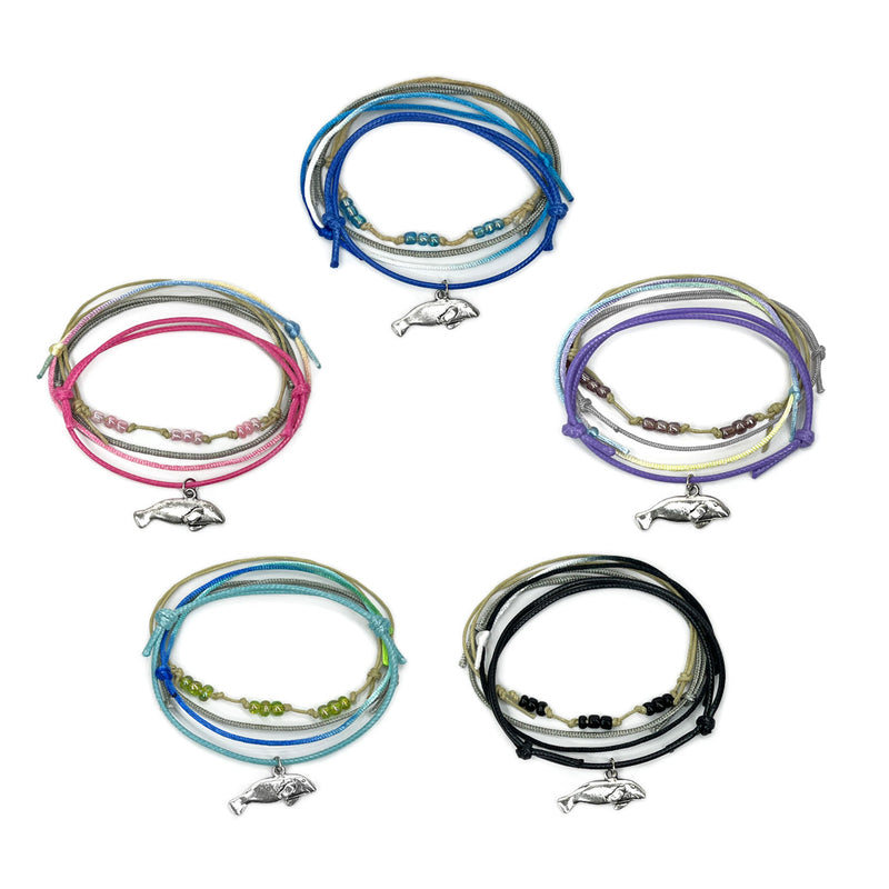 O Yeah’s Manatee Bead Bracelet Collection featuring silver manatee charms and colorful cords in pink, blue, purple, green, and black.
