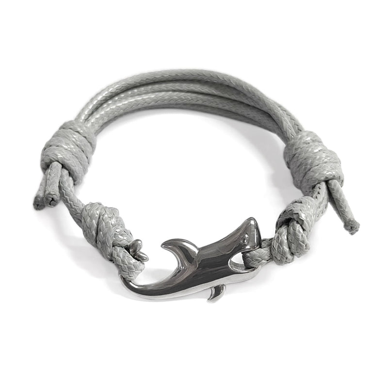 Men’s gray nylon cord bracelet with a polished stainless steel shark-shaped clasp, offering a stylish and durable accessory. Adjustable to fit wrists sized 4-6 inches, this shark bracelet is perfect for adding a sleek, playful touch to any casual or formal outfit.