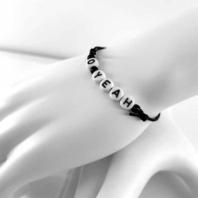 O Yeah black string letter bead bracelet on Linn the Mannequin hand, lifestyle display