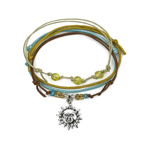 Sun Bracelet Style Pack with gold-tone charm shimmer beads and yellow nylon cords. A sunshine stack for zodiac fans and happy summer styling bracelets.