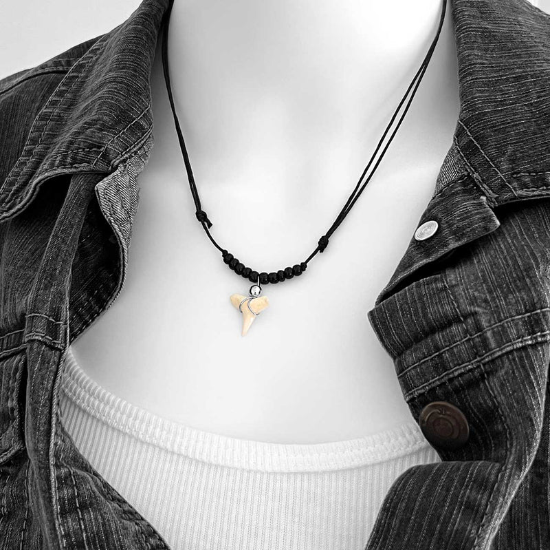 Shark tooth necklace with black beads and black cord, wire-wrapped tooth pendant on adjustable unisex necklace, styled on mannequin in denim jacket