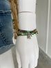 Alligator Bracelet Style Pack on a white mannequin wrist beside denim shorts