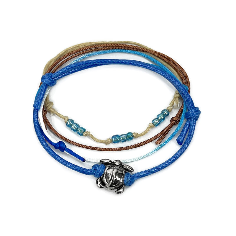 Blue sea turtle bead bracelet with an adjustable string design, featuring a silver sea turtle charm and blue bead accents, perfect for ocean lovers and beach enthusiasts.