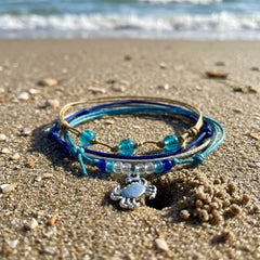 Crab Bracelet Style Pack in a Vacation still life, the silver-tone crab charm in view.