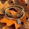 Orange Butterfly Bracelet Style Pack laid on dry brown oak leaves