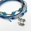 Close-up of the silver-tone crab charm and the glass beads on the Crab Bracelet Style Pack.