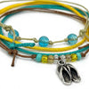 Close-up of the silver-tone flip flop charm and the glass beads on the Flip Flop Bracelet Style Pack.