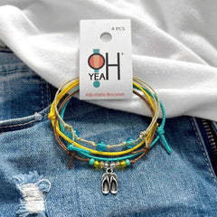 Flip Flop Bracelet Style Pack on its O Yeah four-piece hang tag, laid on denim and a white tee.