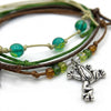 Close-up of the Frog Bracelet Style Pack: silver-tone frog charm, glass beads and green, brown and beige cords