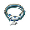 Manatee Bracelet Style Pack: 4 blue, turquoise and beige bracelets with a silver-tone manatee charm, flat lay on white