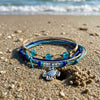 Crab Bracelet Style Pack in a Vacation still life, the silver-tone crab charm in view.