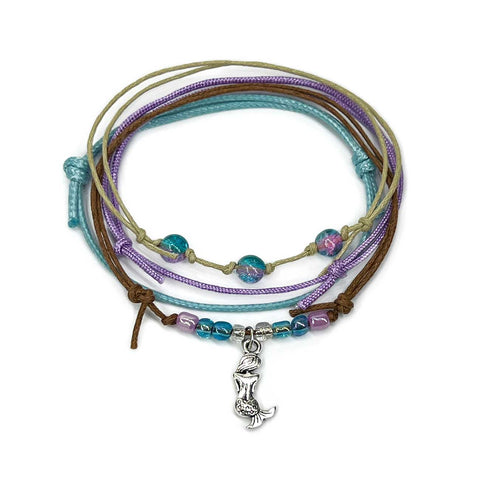 Mermaid Bracelet Style Pack: four bracelets in purple, blue, brown and beige with a silver-tone mermaid charm