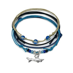 Shark Bracelet Style Pack: 4 blue, black and beige bracelets with a silver-tone shark charm, flat lay on white