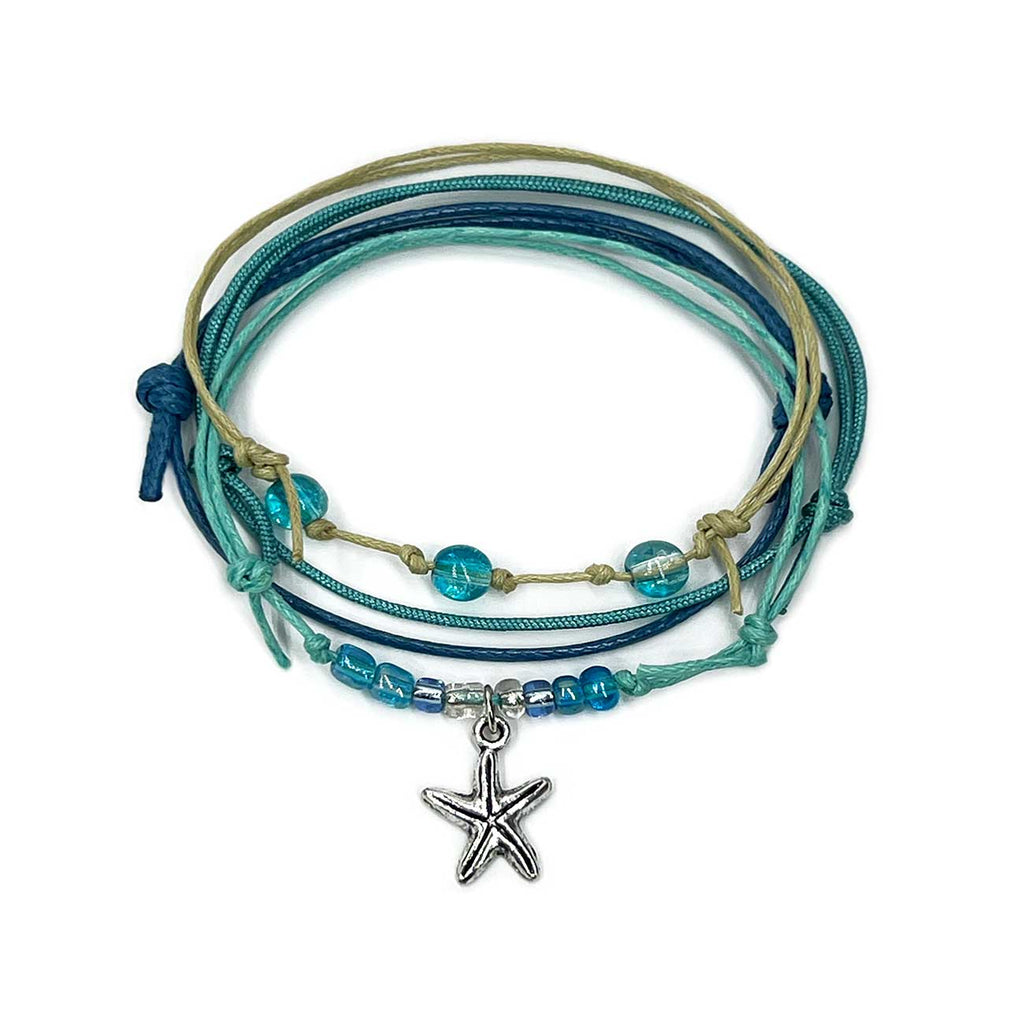 Turquoise starfish bracelet stack on white: 4 adjustable string bracelets in turquoise, blue, beige with a silver-tone starfi