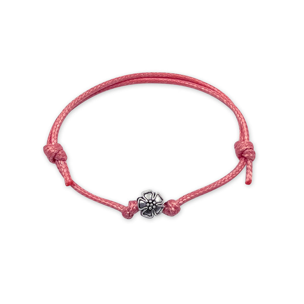 O Yeah Gifts Flower Bracelet – A pink cord bracelet with a silver flower charm, perfect for adding a touch of floral fun and playful style to your look.