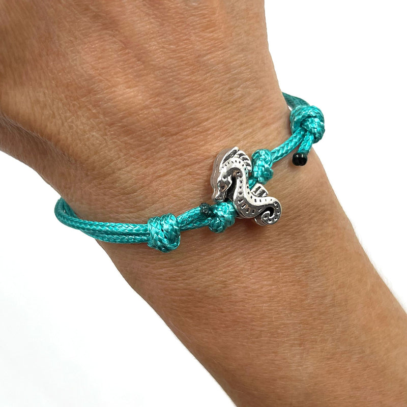 O Yeah Gifts Seahorse Bracelet – Worn on wrist, turquoise cord bracelet with a silver seahorse charm, bringing playful ocean vibes to your style.