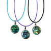 Abalone shell necklace styled with layered chains for a beach-inspired look.