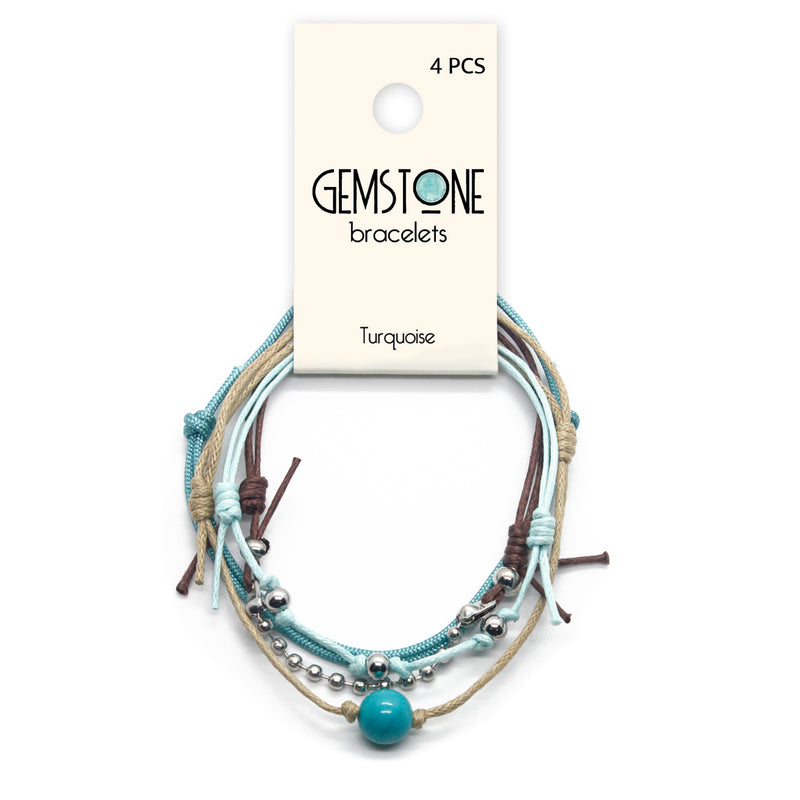 Beaded bracelets with blue and turquoise gemstones, layered for a chic ocean vibe.