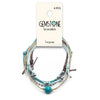 Beaded bracelets with blue and turquoise gemstones, layered for a chic ocean vibe.