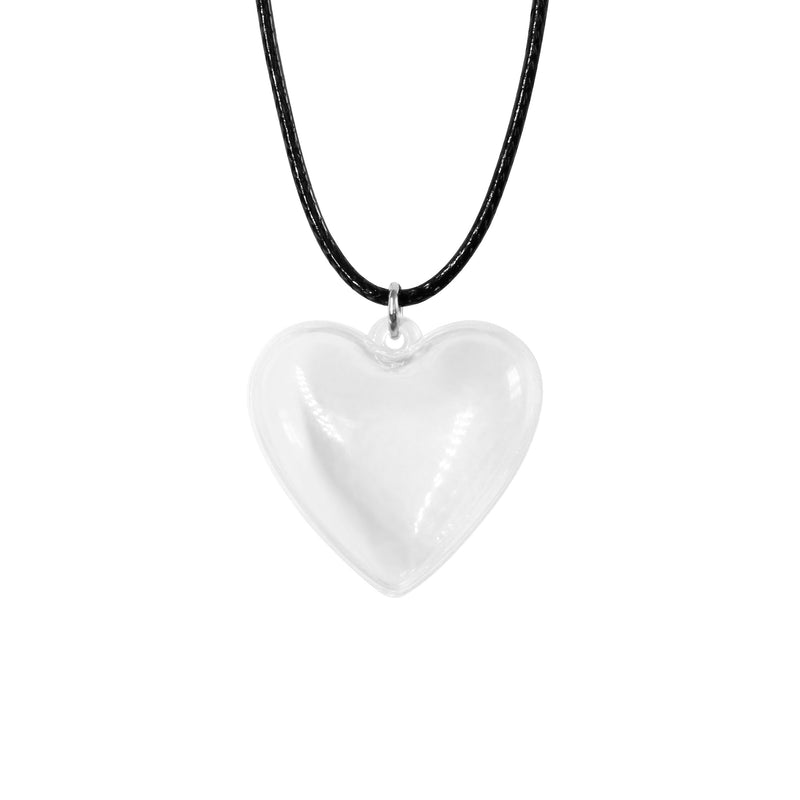 Clear heart keepsake necklace on black wax cord, empty and ready to fill