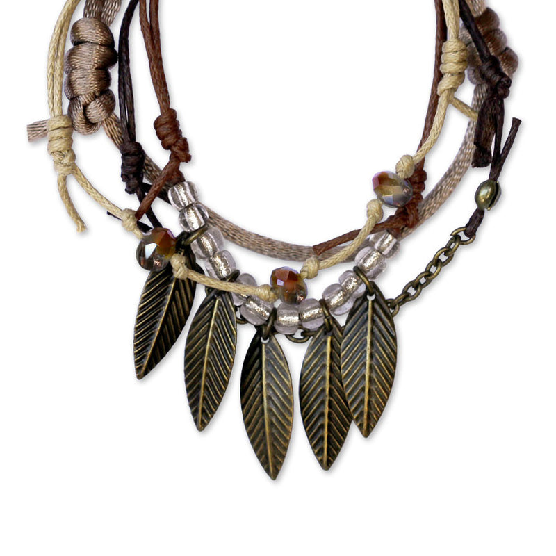 Layered Leaves Bracelet featuring nature-inspired beads, silver leaf charm and stackable style.